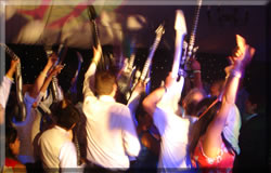 Props such as Air Guitars at a Wedding Disco make for a lively spectacle