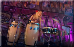 Female Percussionist Lyndsay Evans adds a swing to any music genre.